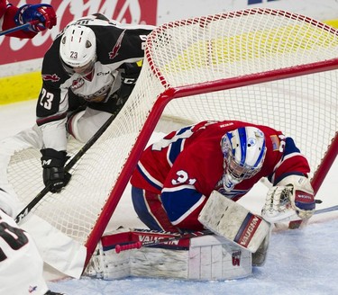 Vancouver Giant Jadon Joseph temporarily upends the net over Spokane Chiefs goalie Bailey Brkin in Game 5 of the WHL Western Conference Championship in Langley April 26, 2019.