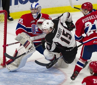 Vancouver Giant Owen Hardy crashes between Spokane Chiefs goalie Bailey Brkin and Bobby Russell in Game 5 of the WHL Western Conference Championship in Langley April 26, 2019.