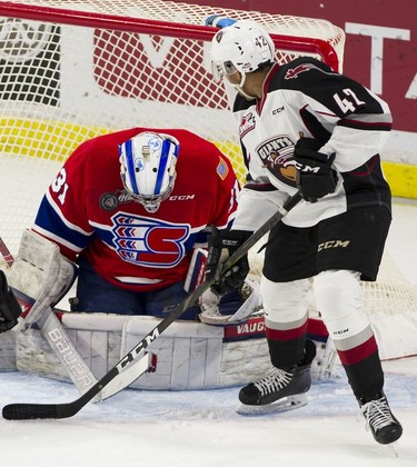 Vancouver Giant Justin Sourdif watches Spokane Chiefs goalie Bailey Brkin stop a shot in Game 5 of the WHL Western Conference Championship in Langley April 26, 2019.