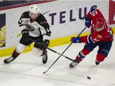 Vancouver Giant Bowen Byram and Spokane Chief Riley Woods battle for the puck in Game 5 of the WHL Western Conference Championship in Langley April 26, 2019.