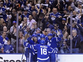 Toronto Maple Leafs centre Auston Matthews (34) celebrates his goal against the Boston Bruins with teammates during second period NHL playoff hockey action in Toronto, on Monday, April 15, 2019.