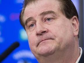 Vancouver Canucks general manager Jim Benning pauses for a moment during a news conference at Rogers Arena in Vancouver on Monday, April 8, 2019. The Canucks finished their season this past weekend failing to make the 2019 playoffs.