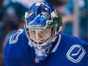 Vancouver Canucks goalie Mikey DiPietro watches the play during the first period of an NHL hockey game against the San Jose Sharks in Vancouver, on Monday February 11, 2019. DiPietro has lost a lot more than he's won in what he calls a "whirlwind" 2019-20 season.