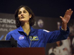 American astronaut of Indian origin Sunita Williams gestures during her interaction with Indian students at the National Science Center in New Delhi, India, Monday, April 1, 2013. Williams, 47, who lived and worked aboard the international space station for six months in 2006, is on a visit to India.