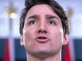 In this file photo taken on March 07, 2019 Canadian Prime Minister Justin Trudeau speaks to the media at the national press gallery in Ottawa, Ontario.