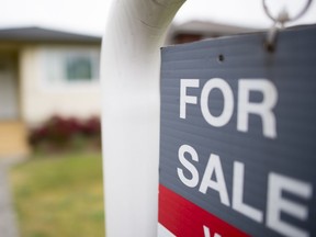 A real estate sign is pictured in Vancouver, B.C., Tuesday, June, 12, 2018.