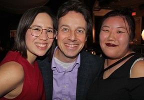 Curatorial interns Alex Cu Unjieng and Diane Hau Yu Wong, along with Centre A’s former executive director Tyler Russell, help celebrate Centre A’s 20th birthday. Photo: Fred Lee.