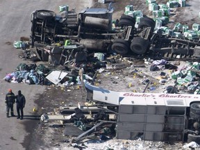 The wreckage of a fatal crash involing the Humboldt Broncos hockey team bus outside of Tisdale, Sask., is seen on Saturday, April, 7, 2018. On the clear, sunny evening, just after 5 p.m., nearly every first responder in the area rushed to the site of the tragic Humboldt Broncos crash. Many say the horrific scene — the bus flipped on its side, the front end completely missing and the roof torn off — has stayed close to them in the year since.