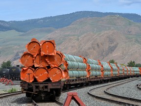 Steel pipe to be used in the Trans Mountain pipeline expansion project on railcars at a stockpile site in Kamloops.