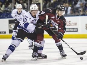 Victoria Royals' Logan Doust checks   Vancouver Giants forward Milos Roman in WHL playoff action at the Save-On-Foods Memorial Centre in Victoria on Thursday, April 11, 2019.