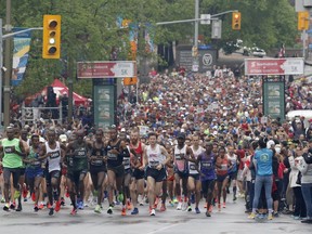 Runners leave the start line of the marathon at the Ottawa Race Weekend on Sunday, May 26, 2019.