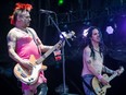 Mike Burkett, left, and Eric Melvin, right, of the American band NOFX perform on day two of the Heavy Montreal music festival at Jean-Drapeau park in Montreal on Saturday, August 8, 2015.