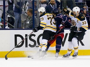 COLUMBUS, OH - MAY 6:  Charlie McAvoy #73 of the Boston Bruins checks Josh Anderson #77 of the Columbus Blue Jackets in the head during the second period in Game Six of the Eastern Conference Second Round during the 2019 NHL Stanley Cup Playoffs on May 6, 2019 at Nationwide Arena in Columbus, Ohio. McAvoy was called for an illegal check to the head.