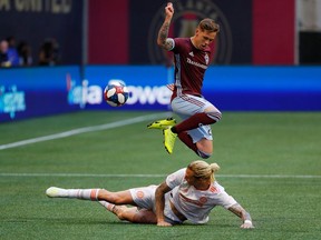 Former Whitecap Brek Shea, making a sliding tackle against Sam Nicholson of the Colorado Rapids in Major League Soccer action last month, will play at B.C. Place Stadium Wednesday night with his new Atlanta United teammates.