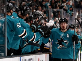 Logan Couture of the San Jose Sharks celebrates with his teammates after scoring a goal during the first period of Game 1 of the NHL Western Conference final against the St. Louis Blues at SAP Center on May 11, 2019 in San Jose, Calif.