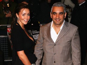 FILE PHOTO: Coca-Cola billionaire and Swissx CEO Alkiviades “Alki” David (right) arrives with a guest at the 'The Bank Job' world premiere at the Odeon West End on February 18, 2008 in London, England.