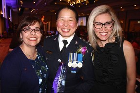 Scotiabank’s Sandra Boyce and Lesly Tayles congratulated the VPD’s Colleen Yee on her big night. The Inspector’s Women’s Personal Safety Workshop program she created won two YWCA Women of Distinction Awards. Photo: Fred Lee.