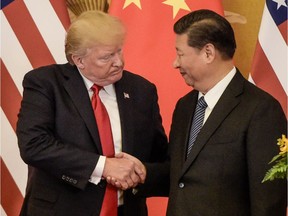 (FILES) In this file photo taken on November 09, 2017, US President Donald Trump (L) shakes hand with China's President Xi Jinping at the end of a press conference at the Great Hall of the People in Beijing. - China said Monday, May 13, 2019 it will raise tariffs on $60 billion worth of US goods from June 1, in retaliation to the latest round of US tariff hikes and Washington's plans to target almost all Chinese imports. The announcement came after the latest round of US-China trade negotiations ended Friday, May 10, 2019 without a deal, and after Washington increased tariffs on $200 billion worth of Chinese goods.