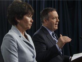 Alberta Premier Jason Kenney and Minister of Energy Sonya Savage discuss the Economic Prosperity Act, which enables Alberta to restrict energy exports, during a news conference in Edmonton on Wednesday.