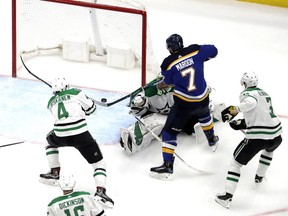 St. Louis Blues' Pat Maroon (7) scores the game-winning goal past Dallas Stars goaltender Ben Bishop, as Miro Heiskanen (4) and John Klingberg (3) help defend during the second overtime in Game 7 of an NHL second-round hockey playoff series Tuesday, May 7, 2019, in St. Louis. The Blues won 2-1 to win the series.