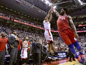 Philadelphia 76ers centre Joel Embiid (21) fails to stop Toronto Raptors forward Kawhi Leonard's (2) last-second basket during second half NBA Eastern Conference semifinal action in Toronto on Sunday, May 12, 2019.