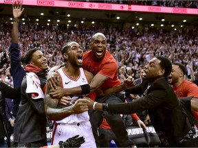 Toronto Raptors forward Kawhi Leonard (2) celebrates his last-second basket with teammates at the end of second half NBA Eastern Conference semifinal action against the Philadelphia 76ers, in Toronto on Sunday, May 12, 2019.