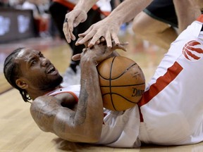 Toronto Raptors forward Kawhi Leonard (2) keeps hold of the ball after being fouled during second half NBA Eastern Conference finals action against the Milwaukee Bucks, in Toronto on Saturday, May 25, 2019. Photo: Nathan Denette/CP