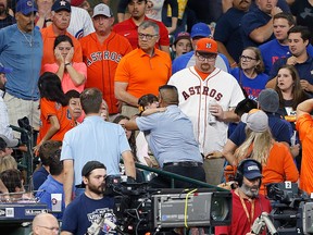 A young child is rushed from the stands after being injured by a hard foul ball off the bat of Albert Almora Jr. of the Chicago Cubs in the fourth inning at Minute Maid Park on May 29, 2019 in Houston, Texas.