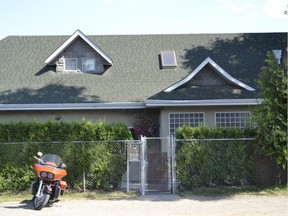 A lone motorcycle is parked outside of the Hells Angels clubhouse in Kelowna, in this 2012 file photo.