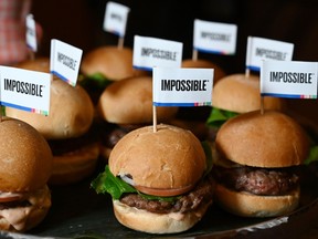 The Impossible Burger 2.0, the new and improved version of the company's plant-based vegan burger that tastes like real beef is introduced at a press event during CES 2019 in Las Vegas, Nevada on January 7, 2019. - The updated version can be cooked on a grill and has a better flavor and lowered cholesterol, fat and calories than the original. "Unlike the cow, we get better at making meat every single day," CEO of Impossible Foods CEO Pat Brown.
