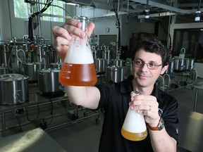 Brewing instructor Alek Egi samples student beers at Kwantlen’s brewing instructional lab.