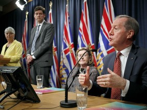 Peter German talks about the recent report on money laundering as Minister of Finance Carole James and Attorney General David Eby and chair of the expert panel Maureen Maloney look on during a press conference at Legislature in Victoria, B.C., on Thursday, May 9, 2019.