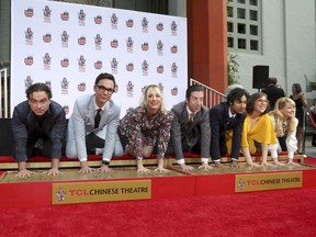 Left to right: Actors Johnny Galecki, Jim Parsons, Kaley Cuoco, Simon Helberg, Kunal Nayyar, Mayim Bialik and Melissa Rauch — stars of the hit TV series "The Big Bang Theory" — place their hands in cement during a hand and footprint ceremony at the TCL Chinese Theatre in Los Angeles on May 1, 2019.
