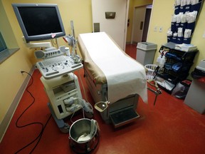 FILE - This Friday, May 17, 2019 file photo shows an examination/procedure room at the Jackson Women's Health Organization in Jackson, Miss. The facility is the state's only abortion clinic. Technology and science have given women unprecedented options and control over fertility since 1973. Back then, single women had only recently gained nationwide access to birth control, thanks to a 1972 Supreme Court ruling, said Dr. Sarah Prager, who directs the University of Washington School of Medicine's family planning fellowship.