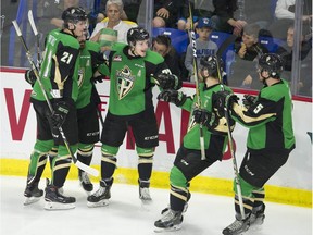 Prince Albert Raiders' Parker Kelly is congratulated by teammates after scoring against the Vancouver Giants during Game 3 of the WHL Championship series at the Langley Events Centre on May 7.