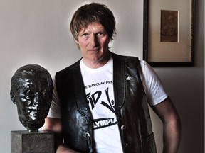 Mark Oliver, who just won an award for a short film on Elvis he debuted at a film festival in Germany, is also a musician and voice actor. He's at home here with a bust of his grandfather in Vancouver on May 15.