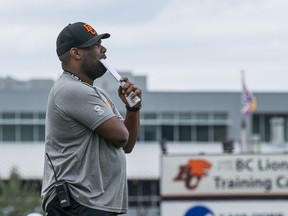 B.C. Lions head coach DeVone Claybrooks watches the team practise during training camp at Hillside Stadium in Kamloops on May 20.