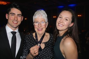 Nursing students Samuel Harris and Megan Crofts flanked Medal of Distinction recipient Colleen Stainton. Photo: Fred Lee