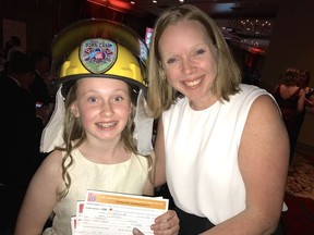 Jennifer Podmore-Russell thanked child burn survivor Keira McKenzie for her philanthropic efforts. The eleven year old raised $10,000 to ensure more kids like her can go to the special summer camp. Photo: Fred Lee.