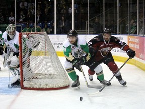 Brayden Pachal of the Prince Albert Raiders and Jadon Joseph of the Vancouver Giants chase the puck in Game 1 of their WHL Championship series at Art Hauser Centre in Prince Albert, Sask. Vancouver won 5-4.