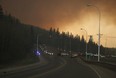 Residents of the subdivision of Abasand wait in their cars to leave the subdivision in Fort McMurray Alta. on Tuesday May 3, 2016. The subdivision had been placed under a mandatory evacuation Tuesday afternoon with wildfires threatening the region.