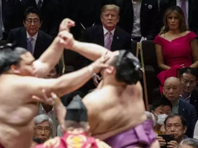 President Donald Trump attends the Tokyo Grand Sumo Tournament with Japanese Prime Minister Shinzo Abe and first lady Melania Trump, top right, at Ryogoku Kokugikan Stadium, Sunday, May 26, 2019, in Tokyo.