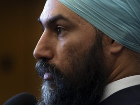 NDP Leader Jagmeet Singh speaks with reporters in the Foyer of the House of Commons during a marathon voting session Thursday March 21, 2019 in Ottawa.