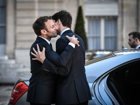 French President Emmanuel Macron bids farewell to Canadian Prime Minister Justin Trudeau as he leaves the Elysee presidential Palace following their meeting in Paris on May 16, 2019.