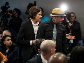 William George, right, a member of the Tsleil-Waututh First Nation, is escorted from the room by a member of the RCMP after interrupting a speech by Prime Minister Justin Trudeau at a Liberal Party fundraising lunch in Vancouver, on Wednesday May 22, 2019.