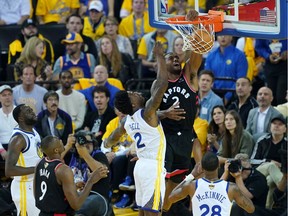 OAKLAND, CALIFORNIA - JUNE 05:  Kawhi Leonard #2 of the Toronto Raptors dunks the ball against the Golden State Warriors in the first half during Game Three of the 2019 NBA Finals at ORACLE Arena on June 05, 2019 in Oakland, California. NOTE TO USER: User expressly acknowledges and agrees that, by downloading and or using this photograph, User is consenting to the terms and conditions of the Getty Images License Agreement.