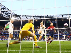 Steph Houghton of England makes a clearance under pressure from Caroline Graham Hansen of Norway (right) during their 2019 FIFA Women's World Cup quarter-final match at Stade Oceane in Le Havre, France, on June 27, 2019. England won 3-0.