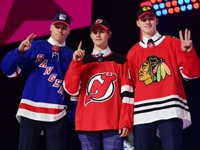 From left Kaapo Kakko (New York Rangers), Jack Hughes (New Jersey Devils) and Kirby Dach (Chicago Blackhawks) pose with their new team jerseys after being drafted as the top three overall picks in the first round of the 2019 NHL Draft at Rogers Arena. (Anne-Marie Sorvin-USA TODAY Sports)