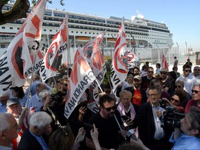 Members of "No grandi navi - No big ships" movement protest in front of the MSC Opera cruise ship that early in the morning crashed against a smaller tourist boat at the San Basilio dock in Venice, Italy June 2, 2019. REUTERS/Manuel Silvestri/File Photo