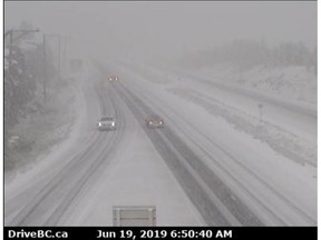 Weather extremes have hit B.C. with snow hitting an Okanagan highway while wildfires bur nearby. Highway 97C is pictured in this highway camera screengrab from Wednesday morning.